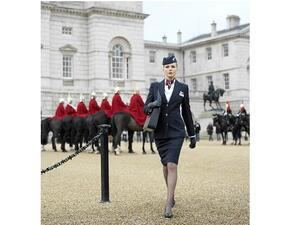 British Airways purser and The Royal Guard in London full-body.