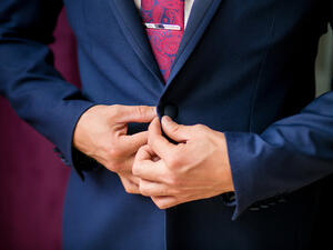 Solid colors suit everyone; avoid clothes that have too much going on. (Shutterstock)