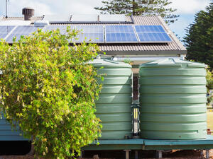 Solar panels and rainwater tanks lessen the impact on the environment. (Shutterstock) 
