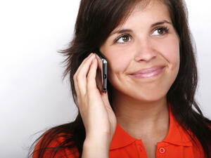 Your voice will sound different on the phone if you are smiling. (Fotolia)
