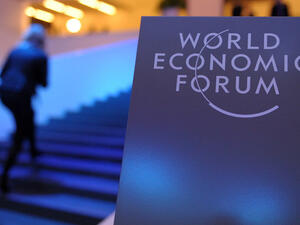 Participants arrive at the congress center prior to the opening of the World Economic Forum in Davos on January 21, 2014. (AFP/ File)