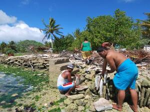 Residents of Kiribati attempt to block the rising tide with stone walls. (File)