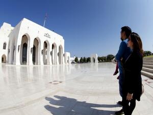 Tourists stand in front of the Royal Opera House in Omani capital Muscat. (AFP/File)