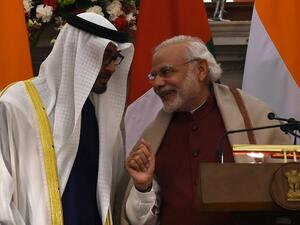 Indian Prime Minister Narendra Modi (R) shares a light moment with Abu Dhabi's Crown Prince Sheikh Mohammed bin Zayed al-Nahyan at Hyderabad House in New Delhi on February 11, 2016. (AFP/Money Sharma)