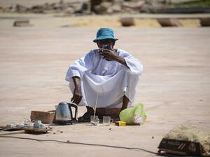 An Egyptian worker drinks tea at Karnak temple in Luxor, Egypt, on June 11, 2015. (AFP/Mohamed el-Shahed)