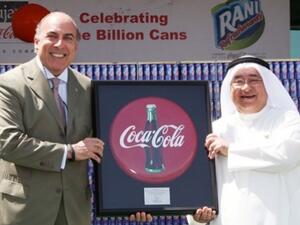 Sheikh Adel Aujan (right), chairman, Aujan Group Holding, and Muhtar Kent, chairman and CEO, The Coca-Cola Company, celebrate the billionth can of Rani produced under their partnership. (Coca-Cola)
