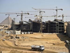 Egypt's currency devaluation has increased costs for the construction industry, negatively impacting developers’ cash flows.  (AFP/File)