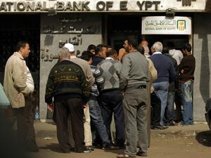 Thousands of importers have been caught out by the float, facing ballooning dollar debts after they had opened dollar credit-lines with banks.   (AFP/Patrick Baz)