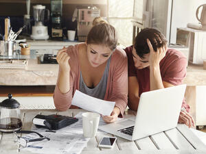 Clarifying who is responsible for paying bills and out of which bank account can help you keep track of your household spending. (Shutterstock)