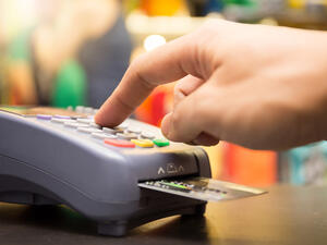 The average person in the UAE owes $11,590 in debt, often the form of credit card balances and car loans. (Shutterstock)
