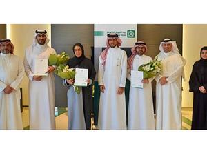 Mr. Abdulhakeem AlKhayyat, the honored employees with officials and executives from the Bank
