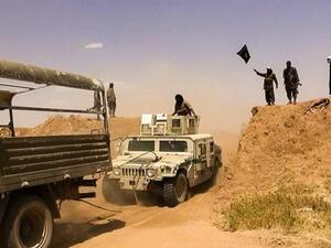 Daesh militants on a road at the Syrian-Iraqi border. (AFP/File)