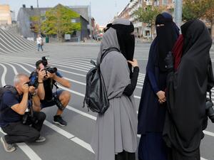 Women are protesting a ban on face-covering garments, which went into effect today in Denmark (Twitter)
