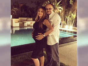 Picture perfect: Carole and her hubby with their bundle of joy. (Facebook)