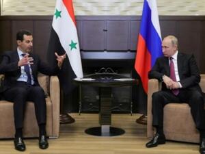 الرئيسان الروسي فلاديمير بوتين والسوري بشار الاسد خلال لقاء جمعهما في سوتشي في روسيا في السابع عشر من ايار
