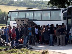 People board in a bus in order to leave the refugee and migrant makeshift camp on the Greek-Macedonia border near the village of Idomeni on May, 23 2016. (AFP/Sakis Mitrolidis) People board in a bus in order to leave the refugee and migrant makeshift camp on the Greek-Macedonia border near the village of Idomeni on May, 23 2016. (AFP/Sakis Mitrolidis)
