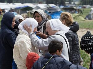 A nun talks to a woman at a makeshift camp for migrants and refugees near the village of Idomeni not far from the Greek-Macedonian border on May 4, 2016. (AFP/Tobias Schwarz) A nun talks to a woman at a makeshift camp for migrants and refugees near the village of Idomeni not far from the Greek-Macedonian border on May 4, 2016. (AFP/Tobias Schwarz)