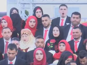 زفاف جماعي لمئات الفلسطينيين بمقر الرئاسة في رام الله (فيديو)
