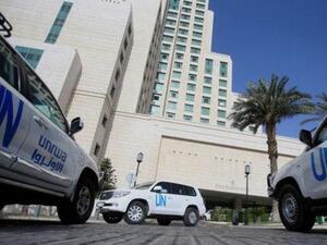 حافلات الأمم المتحدة التي تقل خبراء منظمة حظر الأسلحة الكيماوية في دمشق
