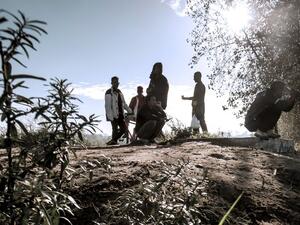 Young migrants are pictured in the 'Jungle' migrant camp, in Calais, northern France, on October 31, 2016, during a massive operation to clear the squalid settlement where 6,000-8,000 people have been living in dire conditions. (AFP/Philippe Huguen)