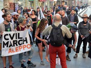 Activists from the "Civil March for Aleppo" group gather on March 22, 2017 in Sarajevo, after walking 1000 kilometers through Europe, commemorating 25 years since the beginning of the siege of Sarajevo, while also protesting against the siege of Aleppo and other cities in Syria. (AFP/Elvis Barukcic)