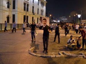 EGYPT, Cairo : A supporter of deposed president Mohamed Morsi holds a picture of him during a rally in Cairo's Six of October bridge on July 15, 2013. (AFP/MOHAMED EL-SHAHED)