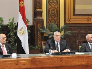 EGYPT, Cairo : A handout picture released by the Egyptian Presidency shows Egypt's vice president Mohamed El Baradei, interim president Adly Mansour and prime minister Hazem El-Bablawi attending the first meeting of the 20 newly appointed Egyptian Governors on August 13, 2013 in Cairo. AFP PHOTO / HO /EGYPTIAN PRESIDENCY 