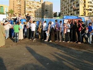 Egyptian supporters of Egypt's deposed president Mohamed Morsi queue to receive food just before breaking their fast during their ongoing sit-in protest outside Rabaa al-Adawiya mosque in Cairo on July 31, 2013.  (FAYEZ NURELDINE/AFP/Getty Images)