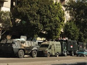 EGYPT, Cairo : Trucks and APC's of Egyptian riot police are parked in the main street leading to Egypt's landmark Tahrir square on August 20, 2013 in Cairo, Egypt.AFP PHOTO/GIANLUIGI GUERCIA