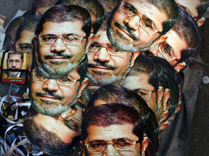 CAIRO, EGYPT - JULY 12: Mohamed Morsi masks are displayed for sale at the base for supporters of ousted president Morsi on the third day of Ramadan, the sacred holy month for Muslims where many will fast from sun-up to sun-down on July 12, 2013 in Cairo, Egypt. ( Spencer Platt/Getty Images)