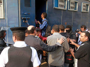 Egyptian policemen in plain clothes detain students of al-Azhar University in Cairo on October 30, 2013. (Image credit: AFP)