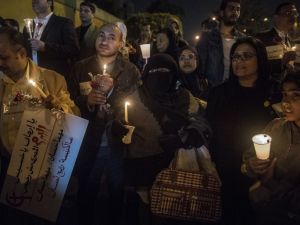 Egyptians attend a candle vigil on December 17, 2016 outside the Saint Peter and Saint Paul Coptic Orthodox Church in Cairo in memory of the people killed in a bomb attack on a Cairo church. (AFP/Khaled Desouki)