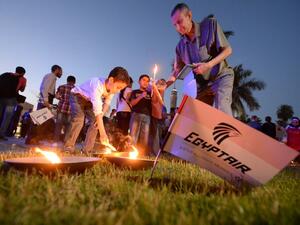 Egyptians light candles during a candlelight vigil for the 66 victims of the EgyptAir MS804 flight that crashed in the Mediterranean Sea, at the Cairo Opera House in the Egyptian capital on May 26, 2016. (AFP/Khaled Desouki) Egyptians light candles during a candlelight vigil for the 66 victims of the EgyptAir MS804 flight that crashed in the Mediterranean Sea, at the Cairo Opera House in the Egyptian capital on May 26, 2016. (AFP/Khaled Desouki)