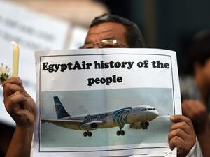 Egyptian journalists take part in a candle light vigil in memory of EgyptAir MS804 victims in front of the Journalists' Syndicate in Cairo on May 24, 2016. (AFP/Mohammed el-Shahed) Egyptian journalists take part in a candle light vigil in memory of EgyptAir MS804 victims in front of the Journalists' Syndicate in Cairo on May 24, 2016. (AFP/Mohammed el-Shahed)