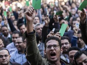 Egyptian doctors gather outside their union in Cairo on Feb. 12, to protest against an alleged assault by policemen on two of their colleagues in a public hospital last month. (AFP/Mahmoud Khaled)