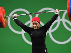 Egypt's Sara Ahmed competes during the Women's 69kg weightlifting competition at the Rio 2016 Olympic Games in Rio de Janeiro on August 10, 2016. (AFP/Goh Chai Hin)