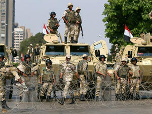 Egyptian army soldiers block Salah Salem highway to prevent supporters of the Muslim Brotherhood and ousted Egyptian president Mohamed Morsi from crossing during their demonstration in Cairo, on July 19, 2013.
(AFP/Marwan Naamani) Egyptian army soldiers block Salah Salem highway to prevent supporters of the Muslim Brotherhood and ousted Egyptian president Mohamed Morsi from crossing during their demonstration in Cairo, on July 19, 2013.
(AFP/Marwan Naamani)