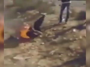 A screengrab shows a Daesh leader trying to extinguish the flames by rolling on the ground. (YouTube)