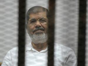 Former Egyptian president Mohamed Morsi faces charges of helping up to 20,000 people escape prison in 2011, including members of the Muslim Brotherhood, Hamas, and Hezbollah. (AFP/File)
