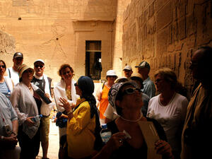 Visitors with a tour guide at the Temple of Philae near Aswan. (Shutterstock/ChameleonsEye)