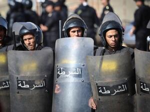 Egyptian police stand in front of the Police Academy. (AFP/File)