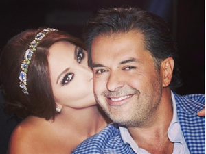 Elissa plants a birthday kiss on Ragheb's cheek. (Facebook)