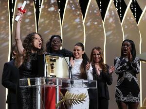 French-Moroccan director Houda Benyamina accepts the Camera d'Or for the film "Divine" during the closing ceremony of the 69th Cannes Film Festival on May 22, 2016. (AFP/Valery Hache)