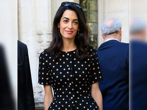 Amal's business unusual as she stands out in a sea of suits. (AFP/File)