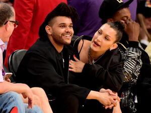Bella and The Weeknd were in matching black, with Bella sporting some trainers instead of her usual stilettos. (AFP/Harry How)