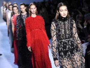 Gigi's makeup was natural apart from some glittery eyebrows. (AFP/Martin Bureau)