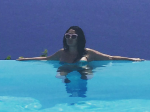 Ghada Abdel Razek maxin' and relaxin' in the sun. Um, what is she wearing?! (Instagram)