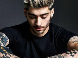 Malik's tattoos distinguished him from the man in the video. (AFP/File)