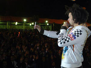 Abd Elfattah Grini greets his audience in Alexandria (Image: Facebook)