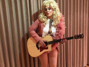 The 29-year-old British singer caught Parton's eye Tuesday on Instagram after posting a photo of herself in a blonde wig and pink suit. (Source: @adele - Instagram)